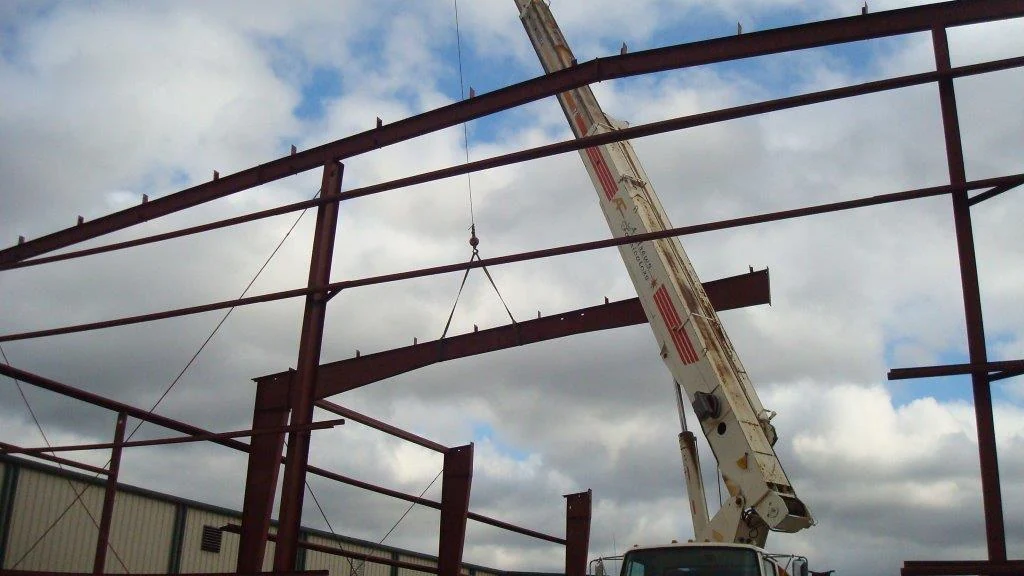 Steel structure being installed with lifting equipment in Andrews’ official gallery